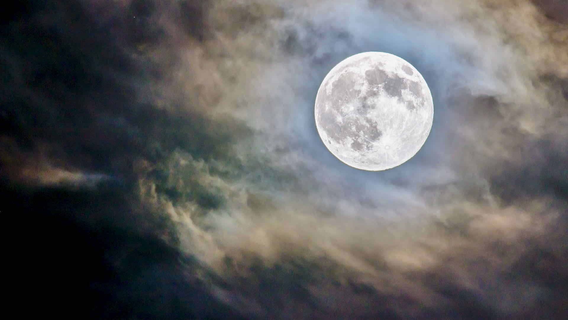 Moon behind clouds Moon behind clouds